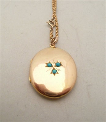 Lot 74 - A 9ct gold turquoise set locket on a rope chain
