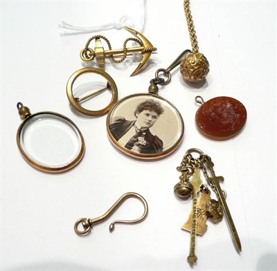 Lot 81 - An anchor brooch stamped '15CT' , an intaglio pendant, picture lockets etc