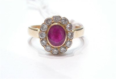 Lot 91 - A ruby and diamond ring