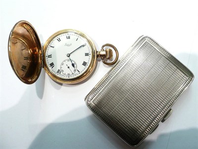 Lot 96 - A silver cigarette case and a plated pocket watch