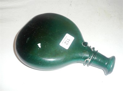 Lot 112 - An emerald green flat-sides 'onion' bottle with trailed neck (a.f.)