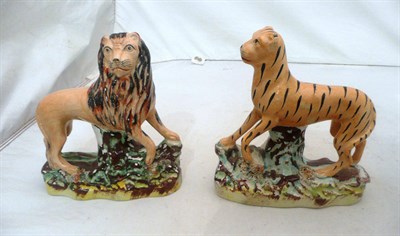 Lot 116 - Pair of Staffordshire figures, a lion and a tiger