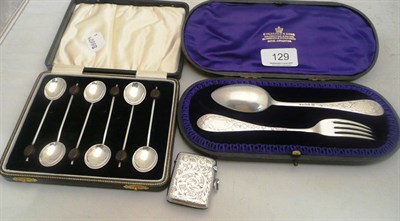 Lot 129 - Cased silver spoon-fork set; silver vesta and set of silver bean spoons