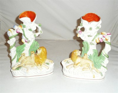 Lot 166 - Pair of Staffordshire 'Lion and Lioness' Spill vases