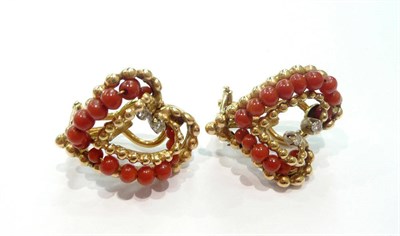 Lot 192 - A pair of 18ct gold coral and diamond heart shaped earrings