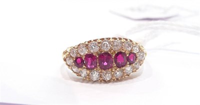 Lot 195 - An 18ct gold ruby and diamond cluster ring
