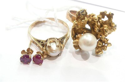Lot 196 - Two cultured pearl rings and a pair of earrings