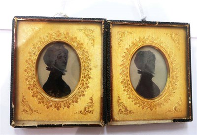 Lot 212 - Two early Victorian trompe l'oeil paintings of a lady in a gilt glazed frame