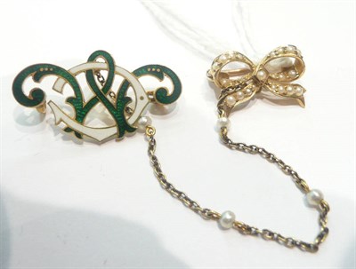 Lot 227 - A seed pearl bow brooch and green and white enamelled attachment of entwined initials 'CM'