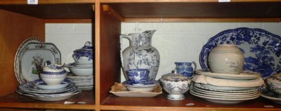 Lot 229 - Two shelves of blue and white ceramics, Sunderland lustre plaque, Parian bread plate etc