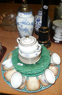 Lot 283 - Four table lamps, an oyster dish, a set of six green cabbage ware plates and a tea set