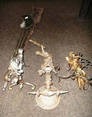 Lot 286 - Pair of brass fire dogs, fire implements, gilt light fitting and spelter figure
