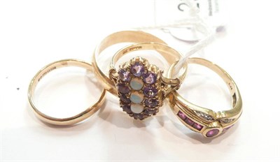 Lot 298 - Four 9ct gold rings, one set with rubies and one set with amethysts and opals