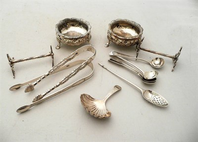 Lot 303 - A pair of silver knife rests, pair of salts, caddy spoon, sugar tongs etc