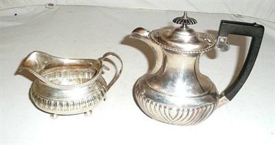 Lot 316 - A late Georgian milk jug (a.f.), a hot water jug, 18.5oz approximate weight