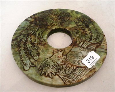 Lot 319 - A jade disk