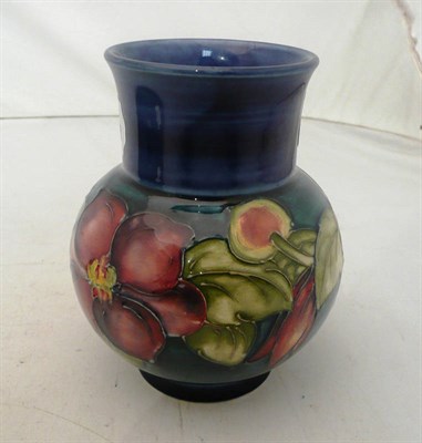 Lot 320 - Walter Moorcroft clematis vase on a blue ground