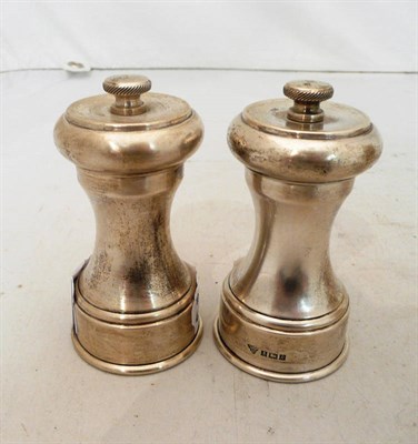 Lot 329 - Pair of silver capstan pepper grinders