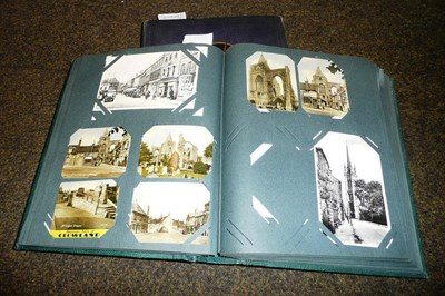 Lot 339 - Two albums of mixed postcards, including a real photograph of Adolf Hitler