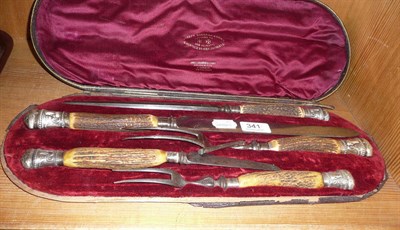 Lot 341 - A silver mounted carving set with antler handles