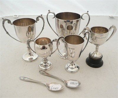 Lot 375 - Two miniature silver trophy cups, two silver teaspoons and three silver plated trophy cups, approx.