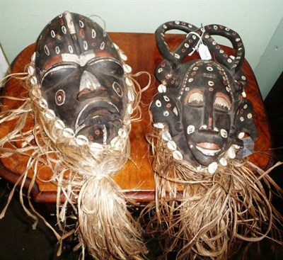 Lot 384 - A Western Pende type wood mask, the domed forehead with raised medial ridge, slit eyes with swollen