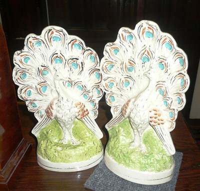 Lot 398 - Pair of Staffordshire 'peacock' groups