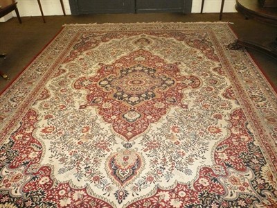 Lot 476 - Red and cream ground carpet