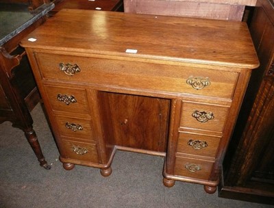 Lot 493 - An oak desk of small proportions