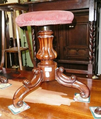 Lot 499 - A rosewood piano stool