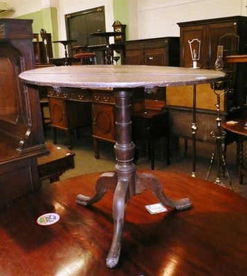 Lot 508 - An oak tripod table