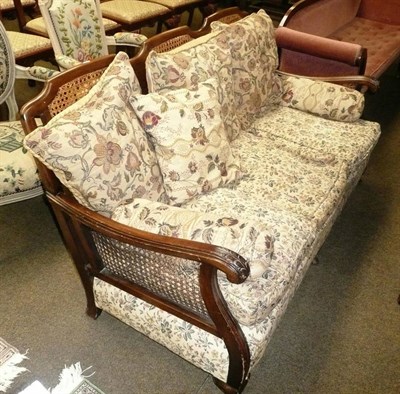 Lot 538 - A three seater bergere settee