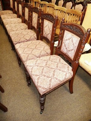 Lot 551 - A set of seven carved dining chairs and a whatnot