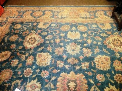 Lot 559 - Agra design carpet, India, the soft indigo field with cloud bands, palmettes and scrolling...