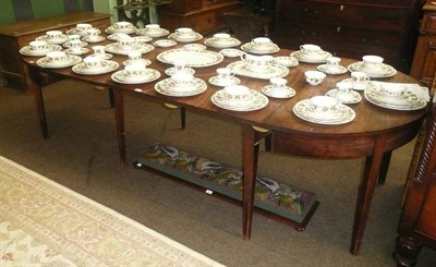 Lot 563 - A George III mahogany 'D' end dining table, with two leaves and a later leaf