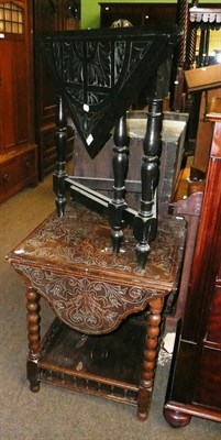 Lot 573 - Two carved oak occasional tables