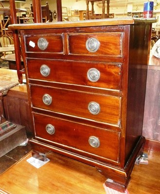 Lot 584 - A small reproduction chest of small drawers