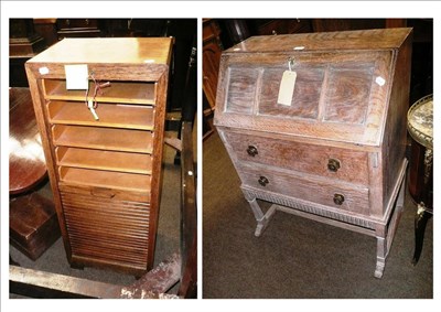 Lot 596 - Oak sheet music cabinet with tambour front and a limed oak bureau