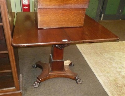 Lot 608 - A 19th century mahogany fold over centre table