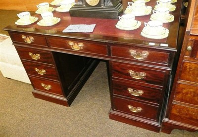 Lot 614 - Mahogany nine drawer desk