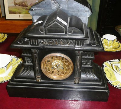 Lot 615 - A black slate mantel clock