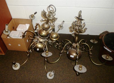 Lot 635 - Two brass six branch chandeliers