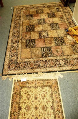 Lot 667 - A pair of rust ground rugs and two others