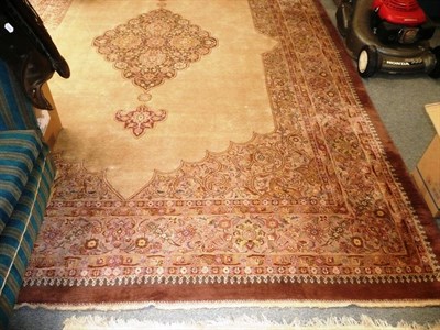 Lot 668 - A large pink Indian ground carpet