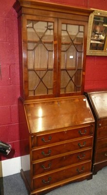 Lot 719 - A reproduction yew wood bureau bookcase