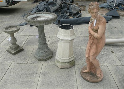 Lot 812 - A large composition bird bath, another smaller, a chimney pot, and a large composition of statue of