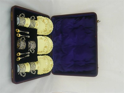 Lot 23 - A cased Worcester coffee set with silver holders (two cups missing, replaced spoons)