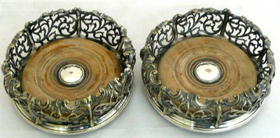 Lot 29 - Pair of silver plated bottle coasters