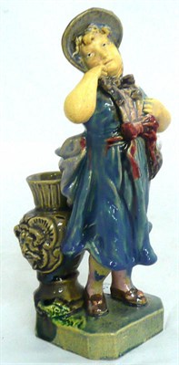 Lot 59 - An early 20th century earthenware figure of a maiden, stamped BU 826