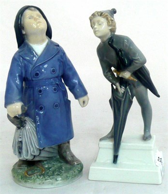 Lot 65 - Two Royal Copenhagen figures of a boy wearing a raincoat, holding an umbrella and a 'Pixie'...